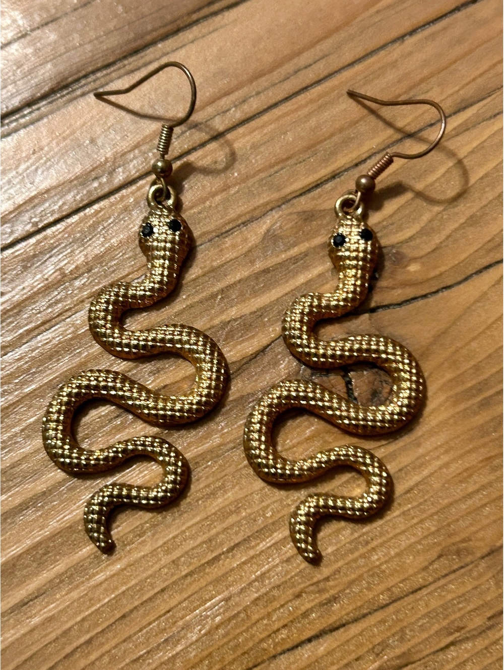 Gold Tone Snake Dangle Earrings with Black Eyes